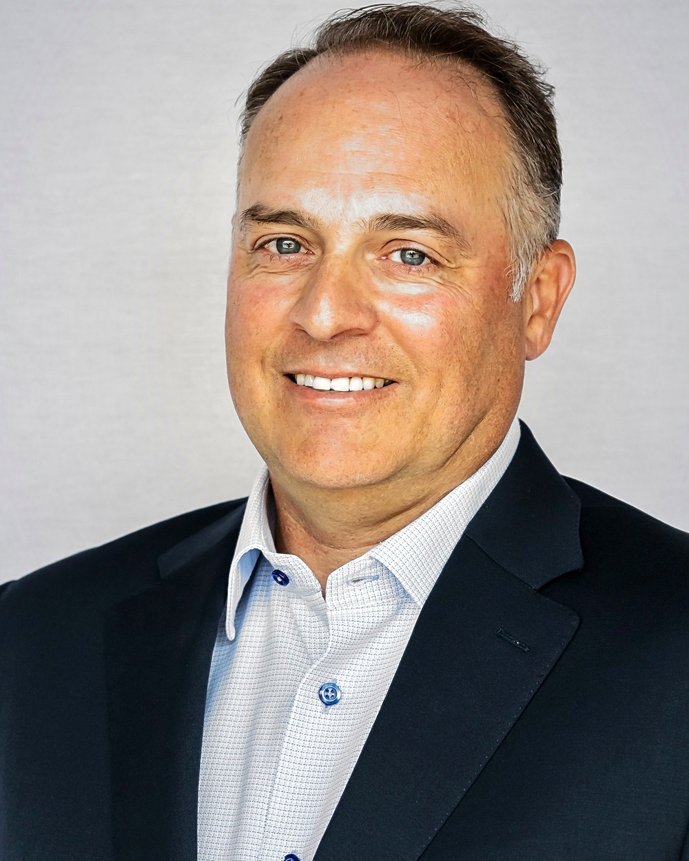 Portrait of Jeff Beer, CEO of Universal Network Services